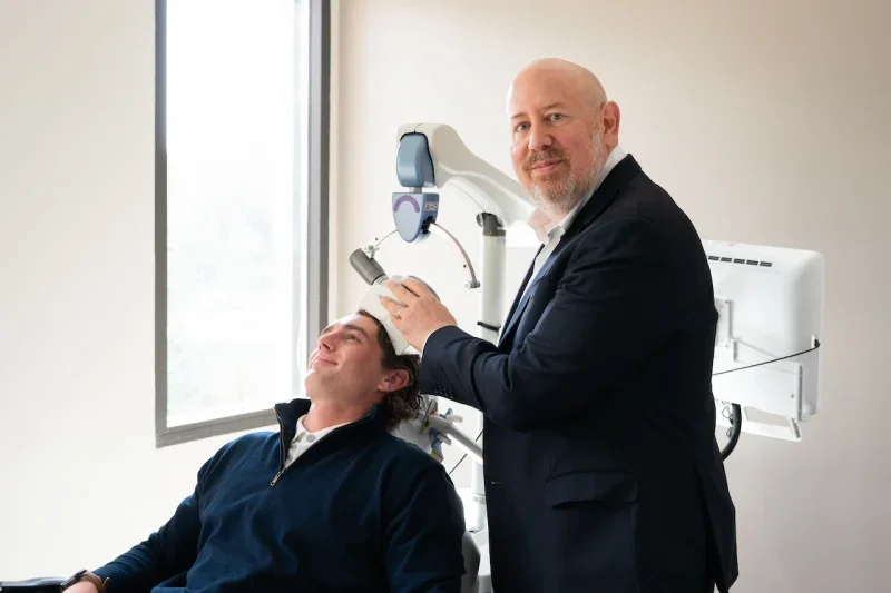 Dr. Raphael Morris administering NeuroStar TMS Therapy