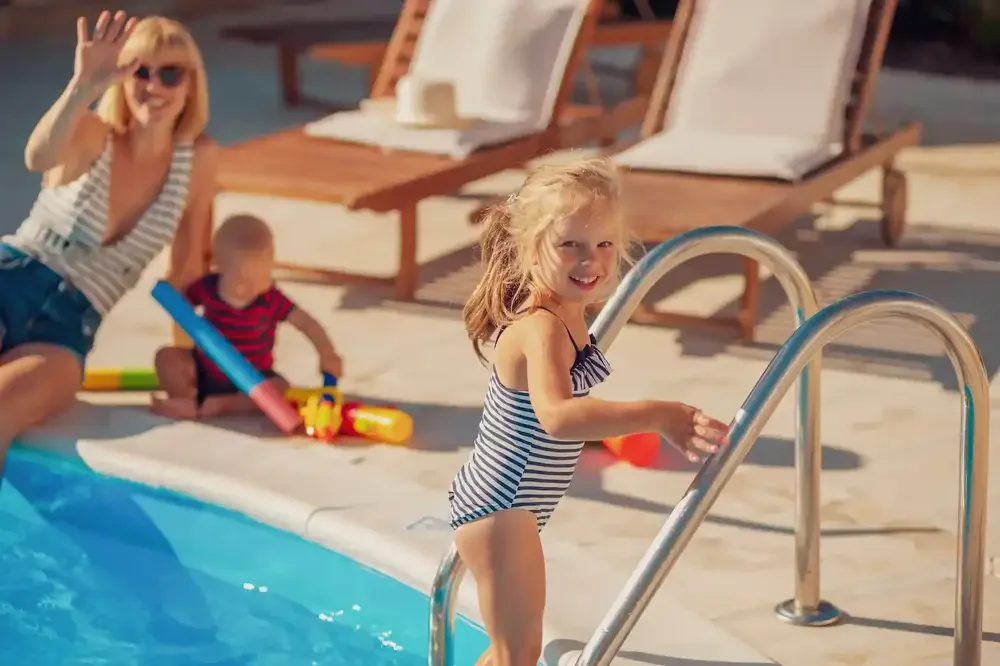 A family enjoying their clean swimming pool