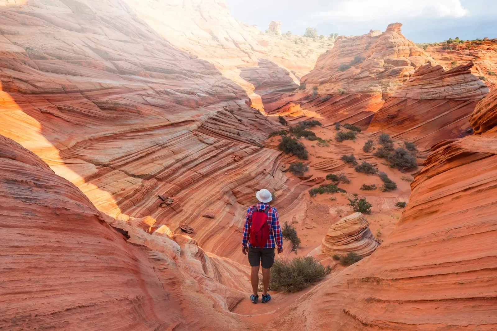Hiker on a Southern Utah trail at golden hour