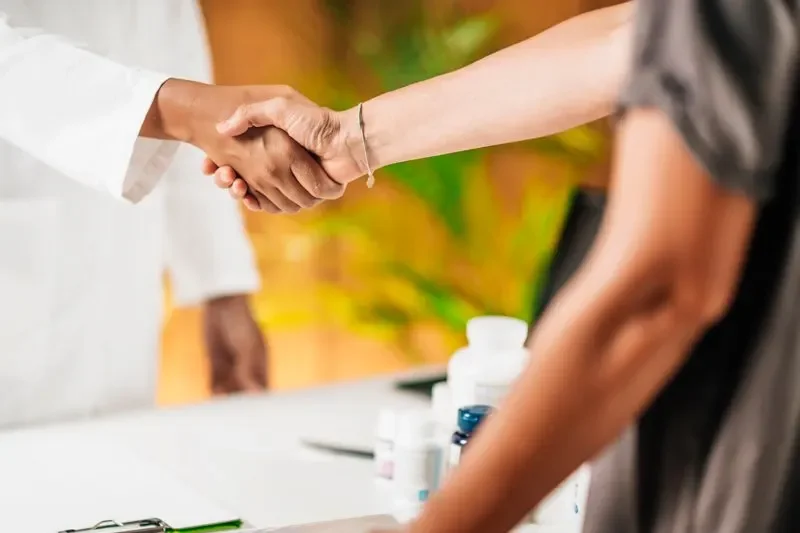 Provider in consultation with a patient at Desert Bloom Healthcare
